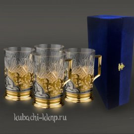 Набор из четырех серебряных подстаканников с позолотой 