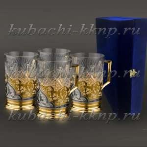 Набор из четырех серебряных подстаканников с позолотой 