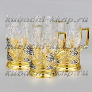 Набор из четырех серебряных подстаканников с позолотой  Набор из четырех серебряных подстаканников с позолотой